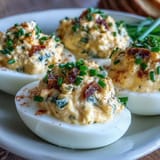 Zesty sweet pickle relish deviled eggs, a flavorful appetizer, perfectly chilled and garnished.